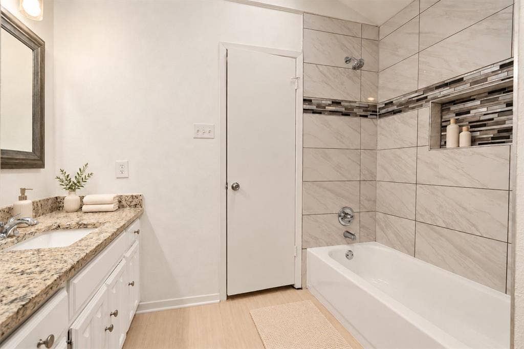 2713 Belmeade Drive, Carrollton, TX 75006 Second bath with tub and shower. Virtually staged.