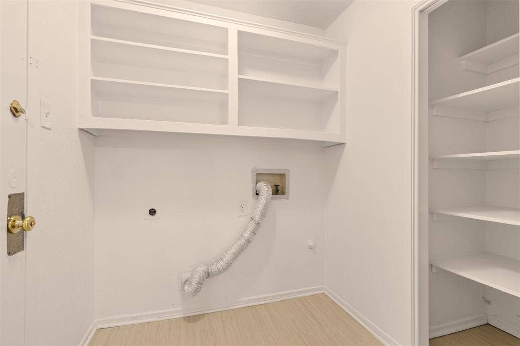 2713 Belmeade Drive, Carrollton, TX 75006 Laundry room with built-in shelves.