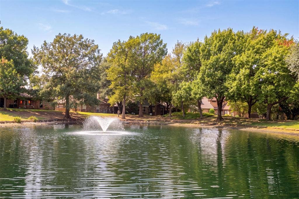 2713 Belmeade Drive, Carrollton, TX 75006 Neighborhood pond with fountain.