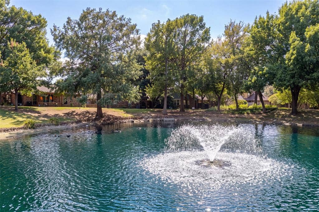 2713 Belmeade Drive, Carrollton, TX 75006 Neighborhood pond with fountain.