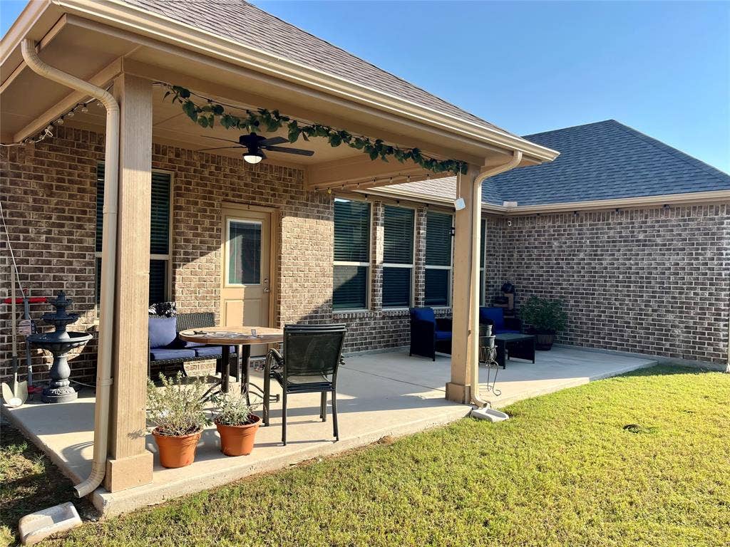 3636 Wintergreen Street, Grand Prairie, TX 76065 Covered concrete patio with a ceiling fan, recessed lighting, and brick exterior