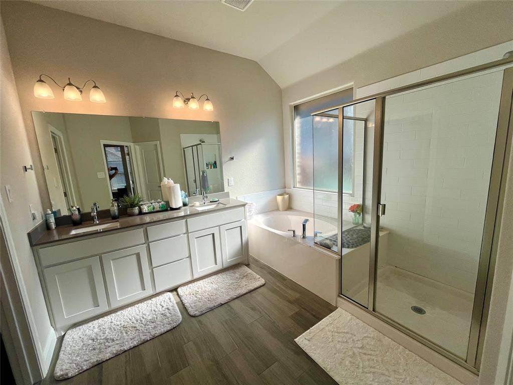 3636 Wintergreen Street, Grand Prairie, TX 76065 Dual vanity with undermount sinks and dark countertops