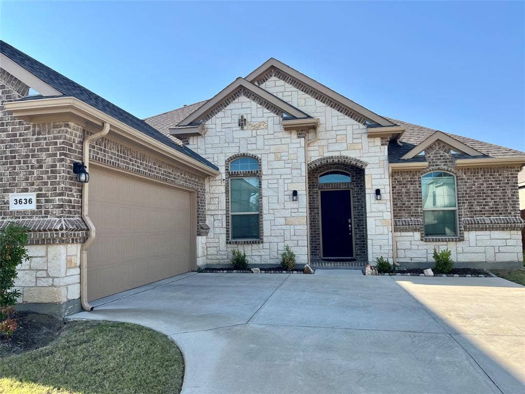 3636 Wintergreen Street, Grand Prairie, TX 76065 2 car garage on the side of the home