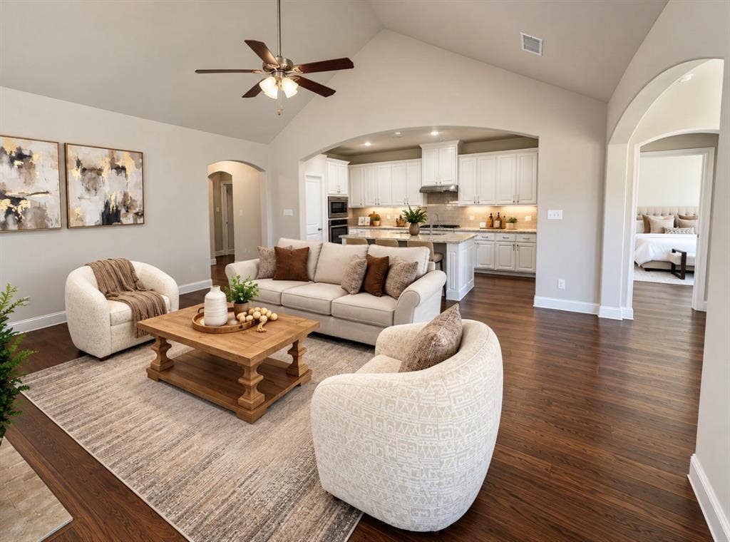 16116 Plum Court, Prosper, TX 75078 Vaulted ceiling with ceiling fan, dark wood-finish flooring, arched doorways, white kitchen cabinetry, and built-in kitchen appliances