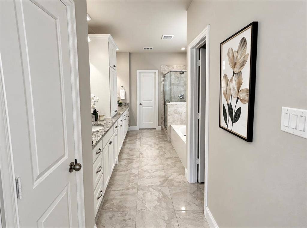16116 Plum Court, Prosper, TX 75078 Dual vanity with under-mount sinks, granite countertops, and white cabinetry