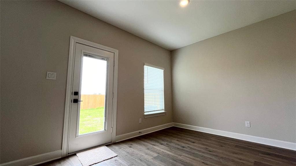 1101 Princeton Heights, Princeton, TX 75407 Wood-finish flooring, recessed lighting, and neutral wall tones