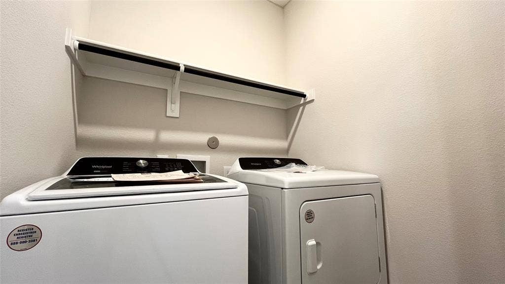 1101 Princeton Heights, Princeton, TX 75407 Built-in shelving with hanging rod, and a full-size washer and dryer
