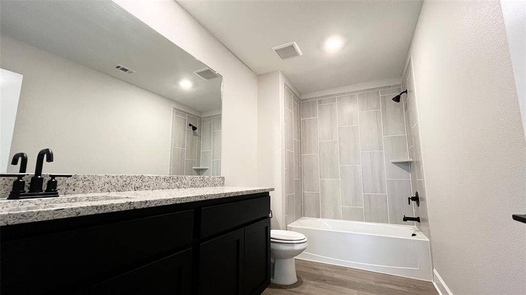 1101 Princeton Heights, Princeton, TX 75407 Vanity with a granite countertop, matte black fixtures, and integrated sink