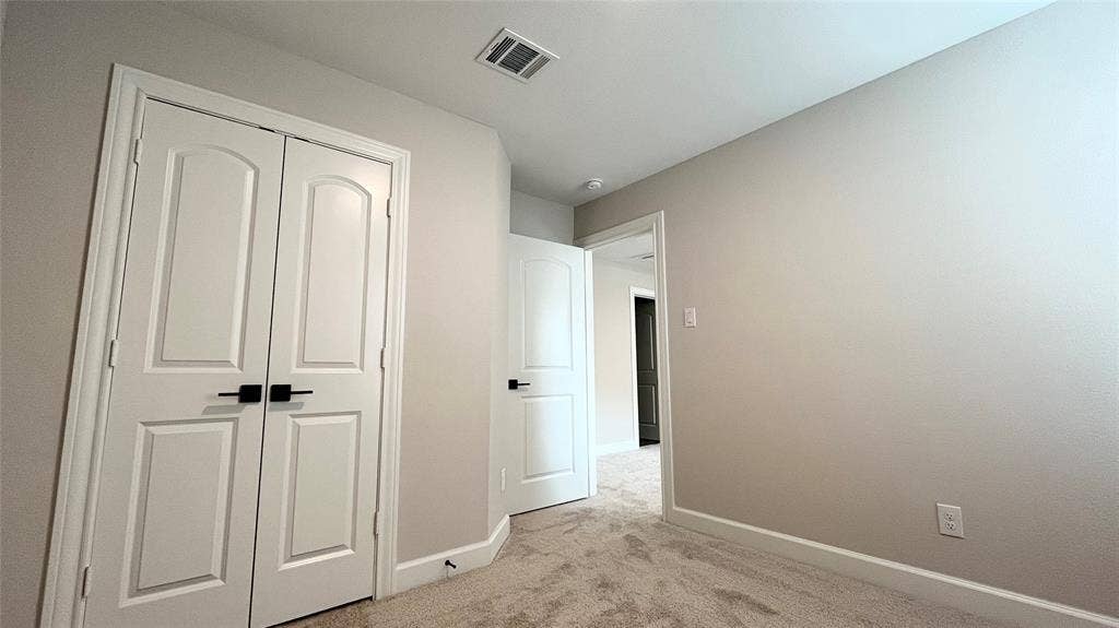 1101 Princeton Heights, Princeton, TX 75407 Light-colored carpeting, white baseboards, and neutral wall paint