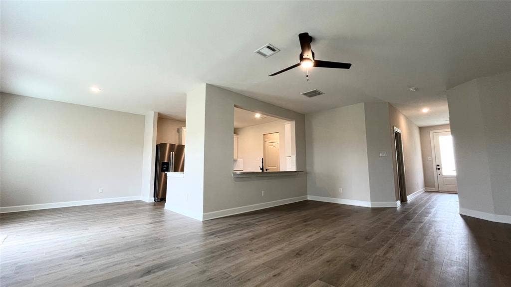 1101 Princeton Heights, Princeton, TX 75407 Wood-finish flooring throughout, recessed lighting, and a modern ceiling fan