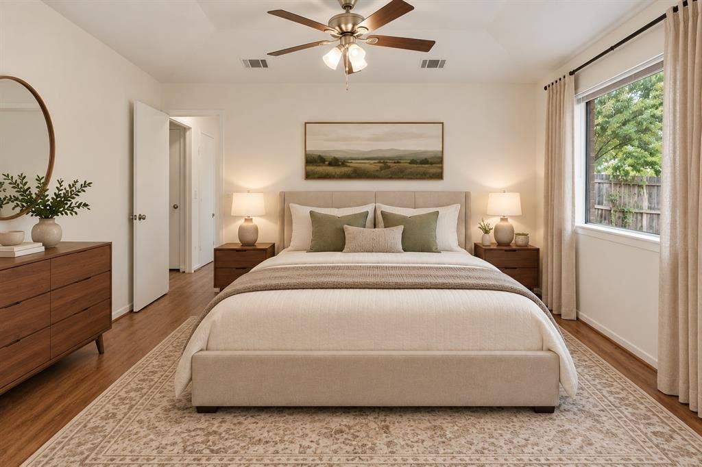1613 19th Street, Plano, TX 75074 Tray ceiling with a ceiling fan, wood-finish flooring, and a large window with roller shades