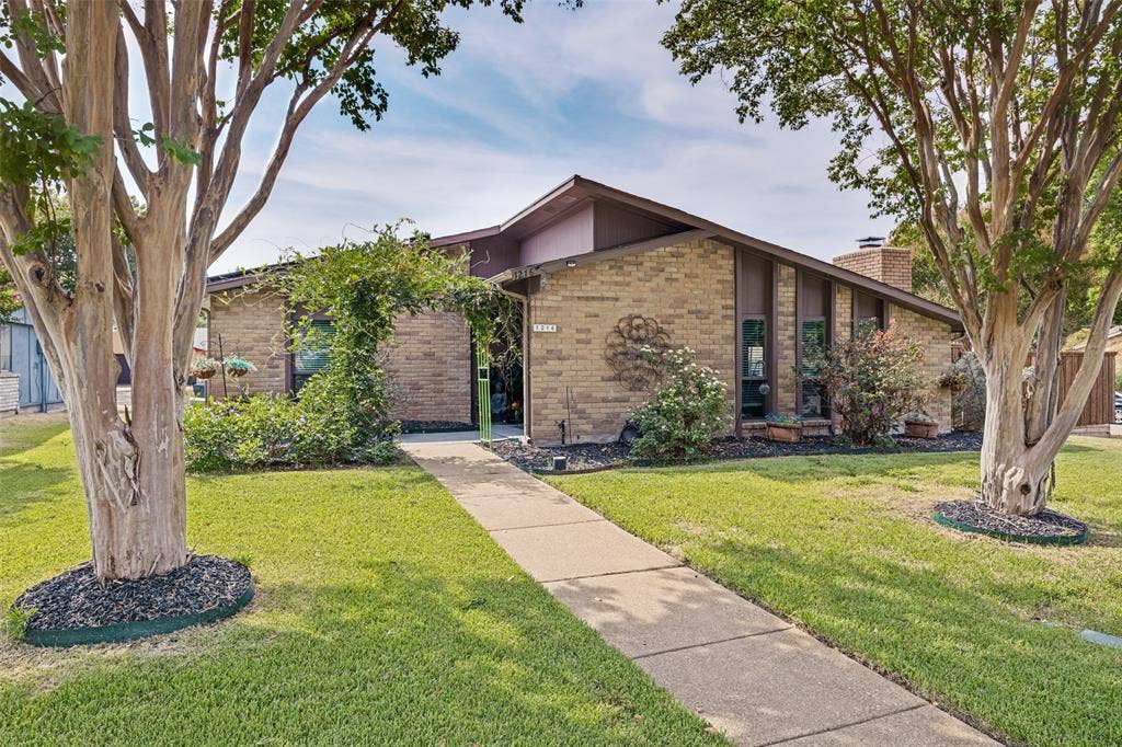 1216 Lombardy Drive, Plano, TX 75023 Brick exterior with a prominent front walkway