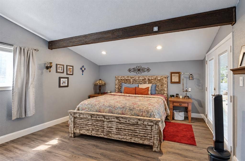 1216 Lombardy Drive, Plano, TX 75023 Vaulted ceiling featuring an exposed beam, wood-finish flooring, recessed lighting, and double French doors with transom windows