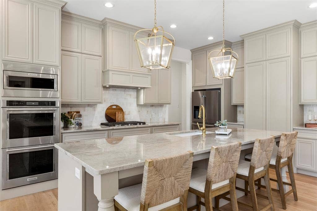 Taj Mahal Quartzite countertops. Double ovens