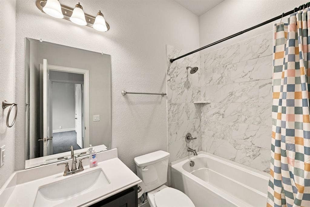 Single vanity with a white countertop and undermount sink