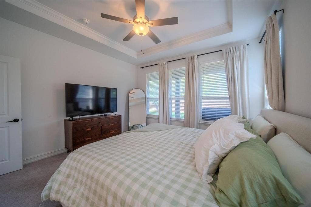 4629 Golden Gate Way, Garland, TX 75043 Tray ceiling with recessed lighting and a ceiling fan