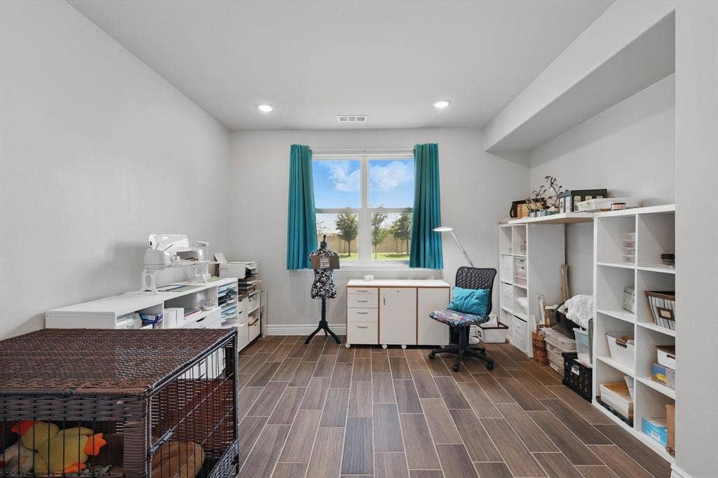 Office area featuring plenty of natural light.