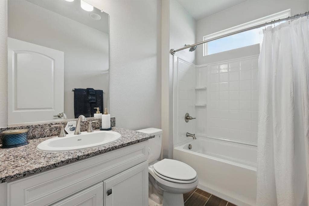 Full guest bath with shower / bath combination .