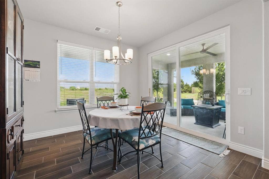Dining space featuring patio access.