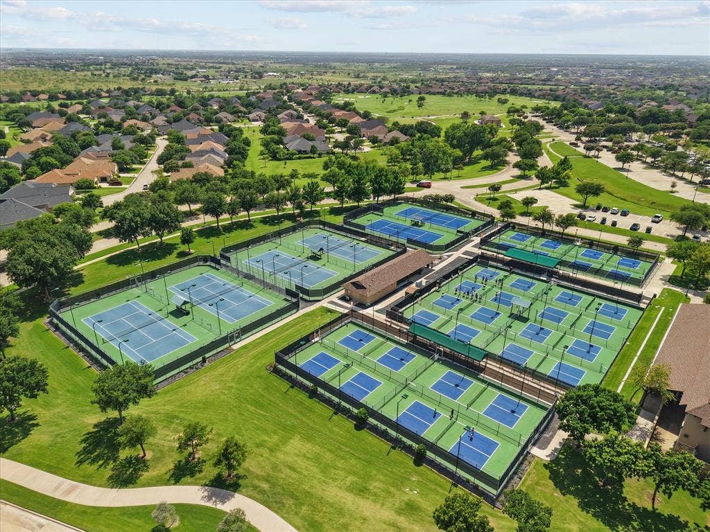 Drone / aerial view of pickleball and tennis courts.
