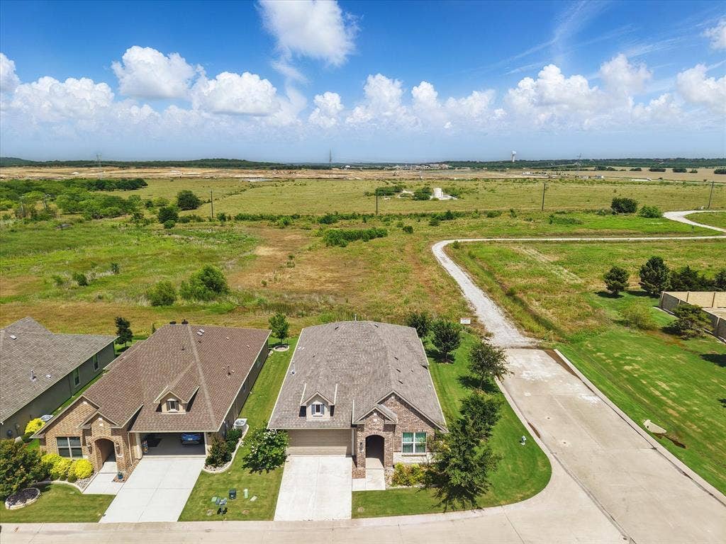 Aerial view of corner lot on quiet street.