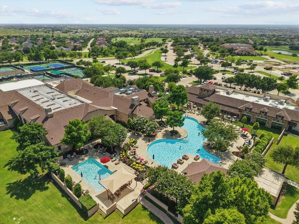 Aerial perspective of Cimmaron Sports Center with resort-style pool.