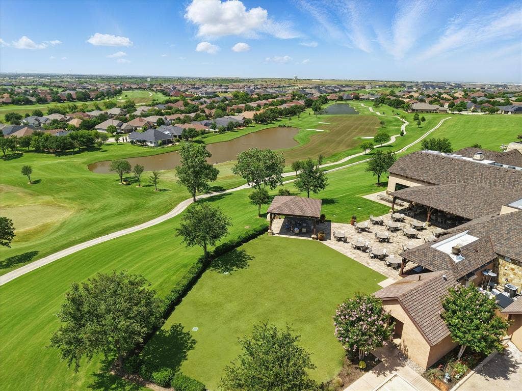 Aerial view of patio area and golf course behind the Wild Horse Grill, lounge, and bar.