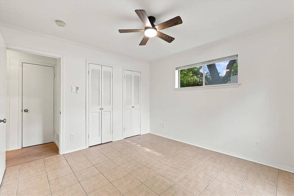 2811 Reedcroft Drive, Farmers Branch, TX 75234 Recessed lighting, ceiling fan with integrated lighting, tiled flooring, horizontal window, and louvered bifold closet doors