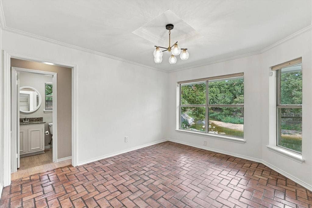 2811 Reedcroft Drive, Farmers Branch, TX 75234 Brick flooring, multiple windows, contemporary chandelier, crown molding