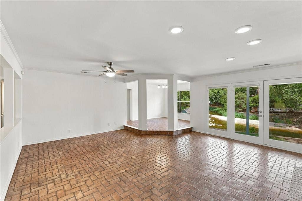 2811 Reedcroft Drive, Farmers Branch, TX 75234 Brick flooring throughout, with a ceiling fan and recessed lighting