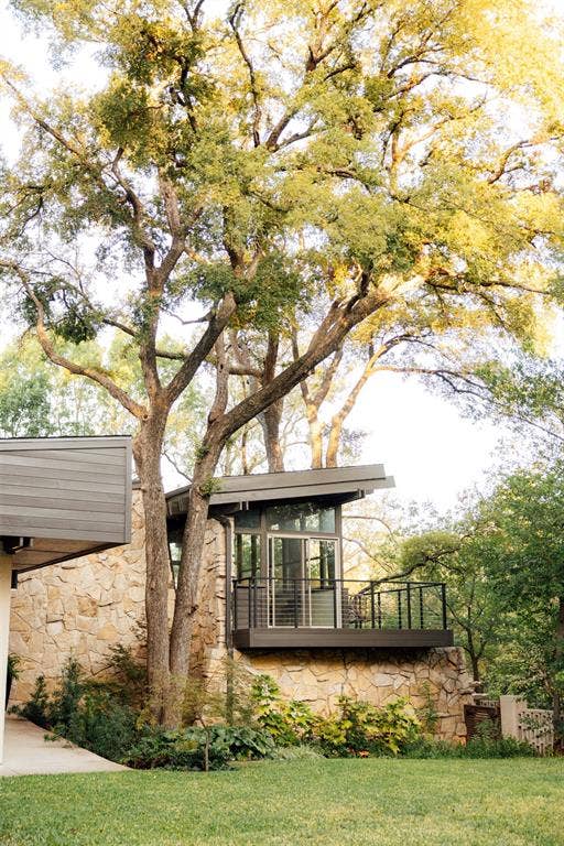 11737 Rogue Way, Dallas, TX 75218 The treehouse room from outside, tucked under mature oak trees