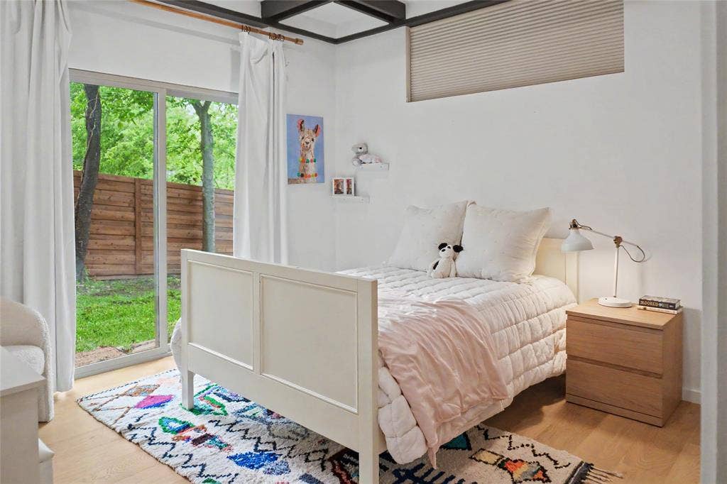 11737 Rogue Way, Dallas, TX 75218 Bright guest bedroom with garden views on the entry level