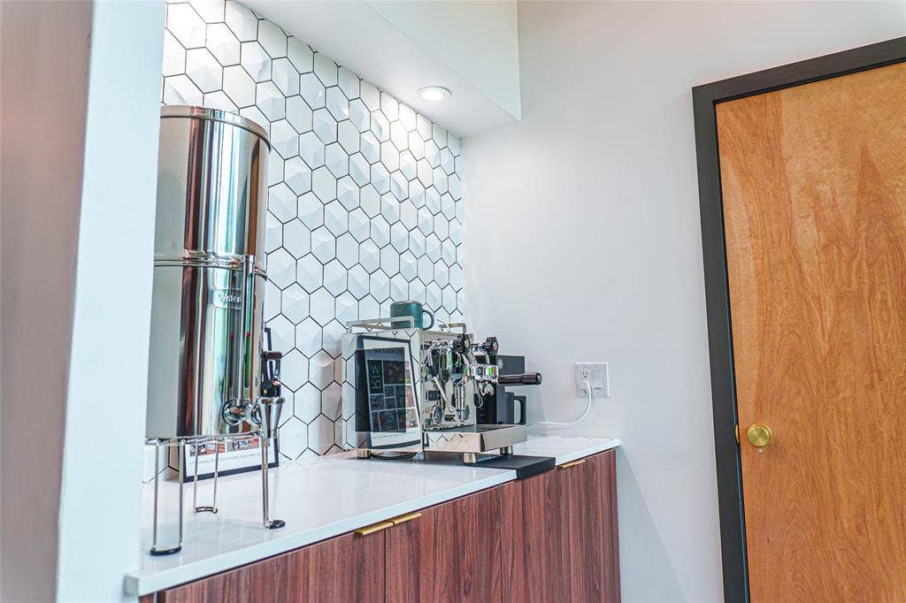11737 Rogue Way, Dallas, TX 75218 Coffee bar with custom cabinetry and designer backsplash