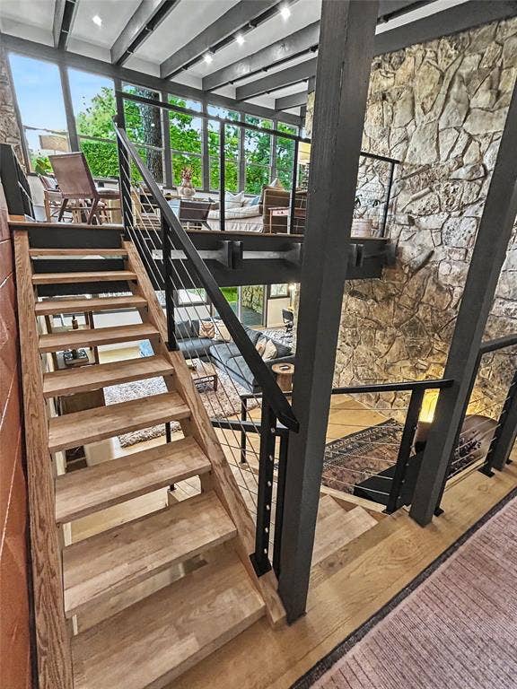11737 Rogue Way, Dallas, TX 75218 Open-tread stairs with treehouse living above and lower living below