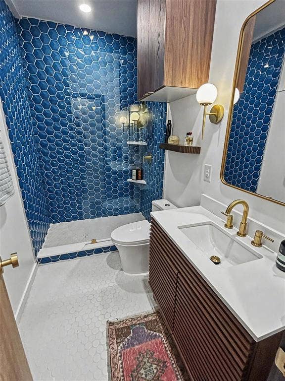 11737 Rogue Way, Dallas, TX 75218 Primary en-suite bath with blue hex tile and slatted wood vanity