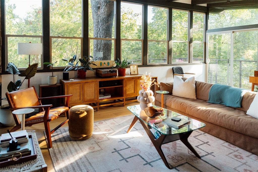 11737 Rogue Way, Dallas, TX 75218 Treehouse living room on the main level, wrapped in windows and oak canopy
