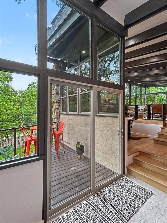 11737 Rogue Way, Dallas, TX 75218 Terrazzo landing with sliders to a treetop balcony