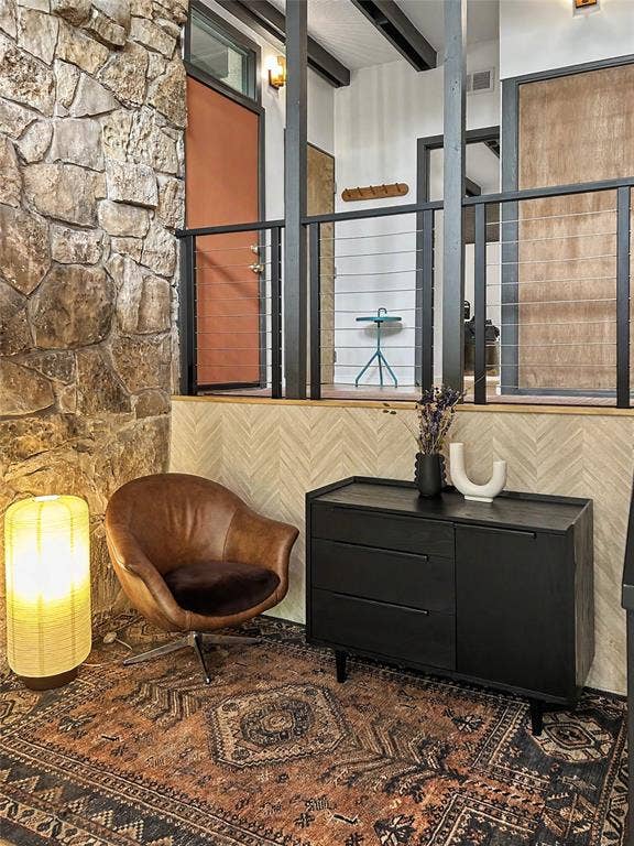 11737 Rogue Way, Dallas, TX 75218 Reading nook with a herringbone wall and a peek up to the entry level