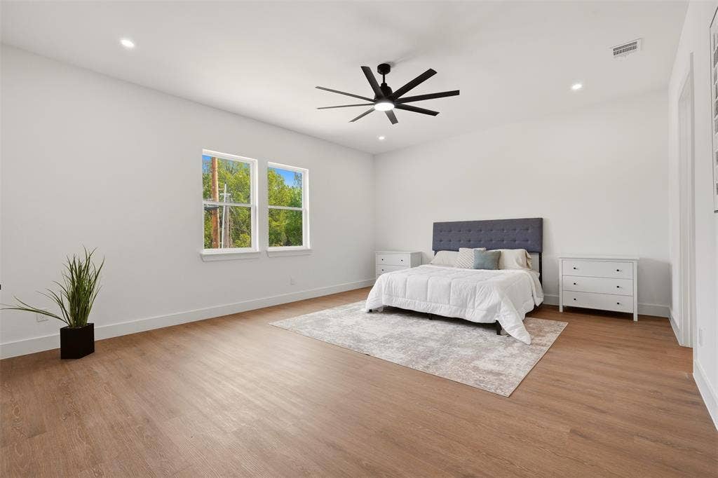 6911 Mohawk, Dallas, TX 75235 Spacious room with wood-finish flooring, recessed lighting, and a modern ceiling fan