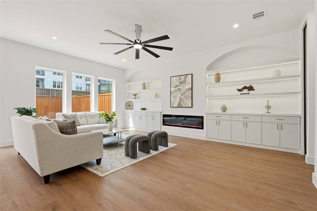 6911 Mohawk, Dallas, TX 75235 Wood-finish flooring, recessed lighting, and a modern ceiling fan