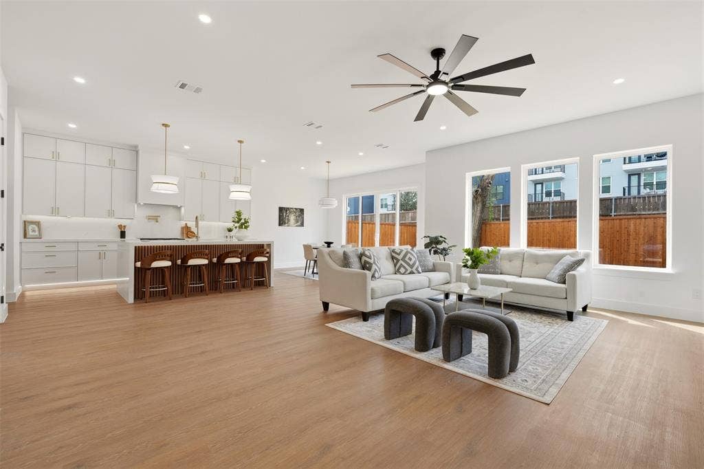 6911 Mohawk, Dallas, TX 75235 Open-concept living space featuring wood-finish flooring, recessed lighting, and a contemporary ceiling fan