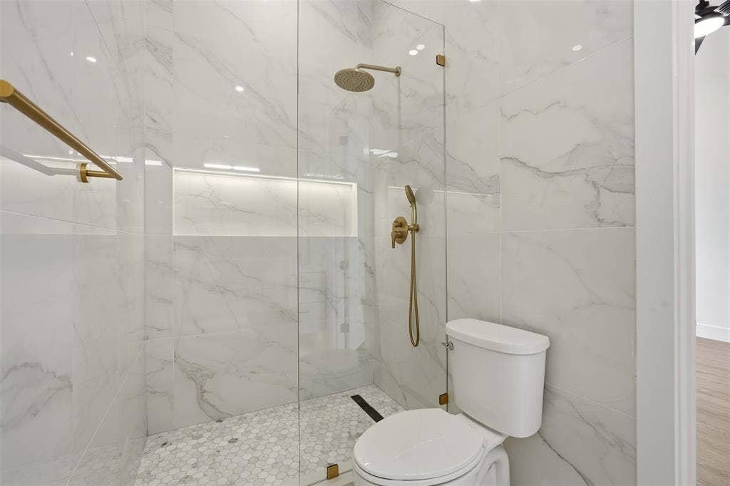 6911 Mohawk, Dallas, TX 75235 Walk-in shower with full-height large format wall tile, rain shower head, and built-in niche