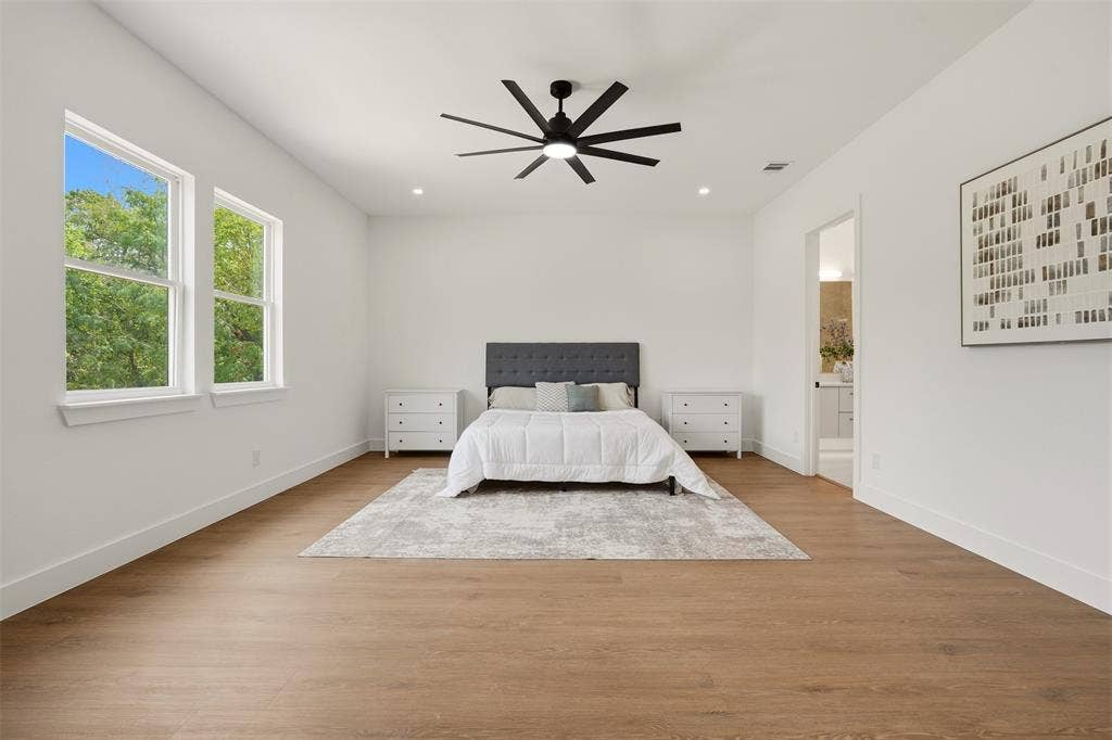 6911 Mohawk, Dallas, TX 75235 Spacious room featuring wood-finish flooring, recessed lighting, and a modern ceiling fan