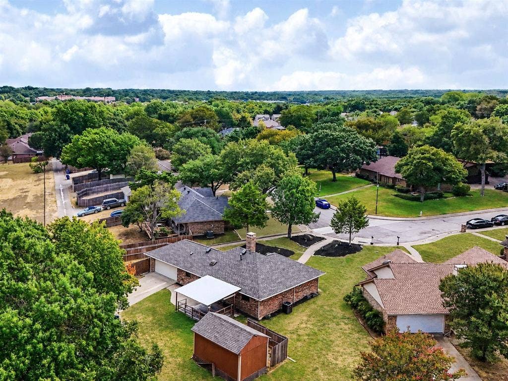 219 N Beltwoods Drive, DeSoto, TX 75115 Mature trees and established landscaping surround the property