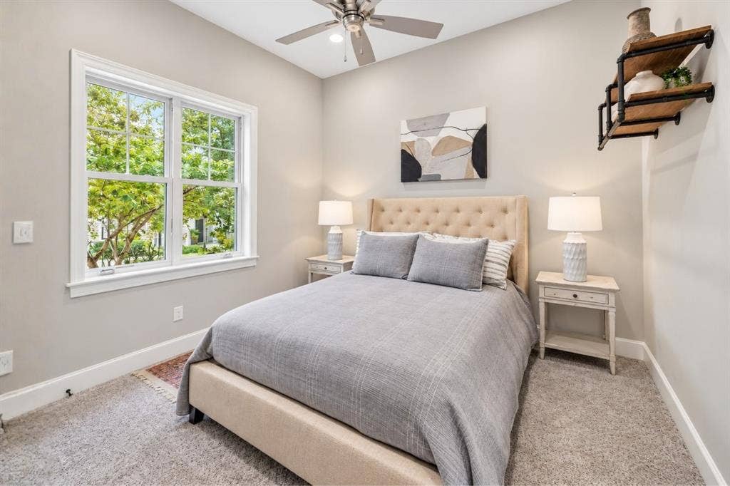 6816 Cousteau Court, Plano, TX 75024 Carpeted flooring, window with gridded panes, ceiling fan, neutral wall tones, built-in wall shelving