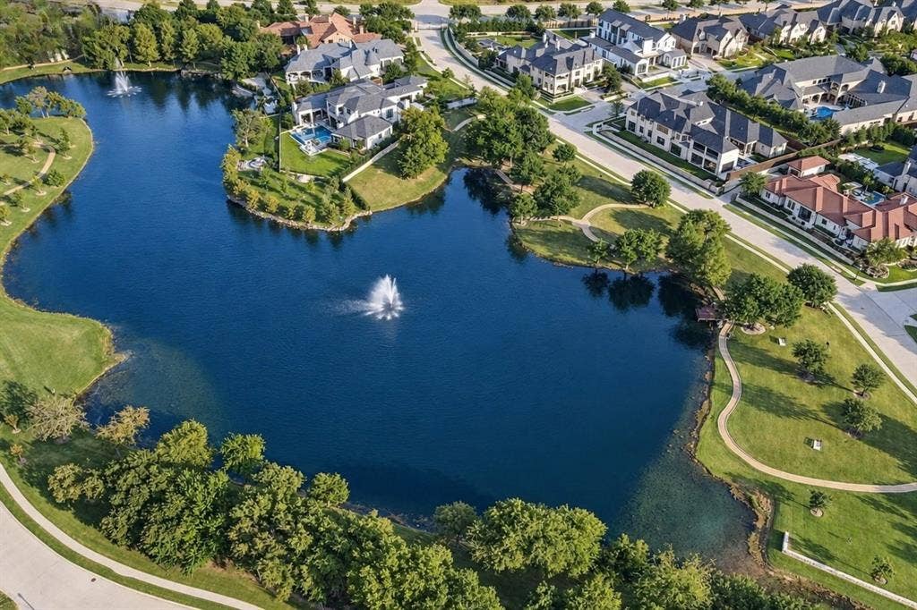 6816 Cousteau Court, Plano, TX 75024 Lakeside residences with manicured grounds, mature trees, and a tranquil water feature