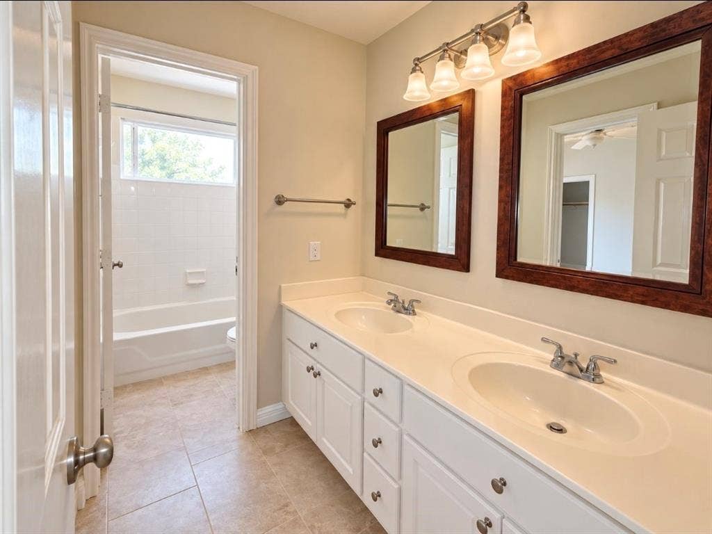 3708 Stockport Drive, Plano, TX 75025 Dual vanity with white cabinetry and integrated sinks