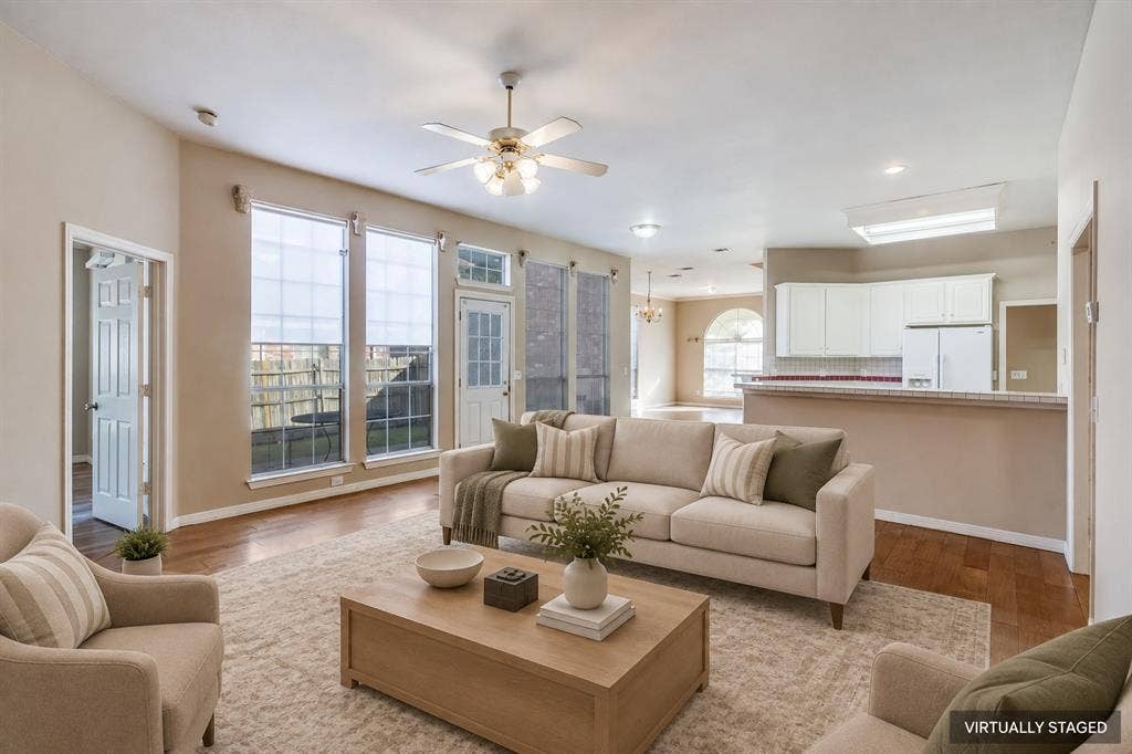 2305 Pittner Lane, Plano, TX 75025 Wood-finish flooring, ceiling fan, recessed lighting, white cabinetry, and a kitchen pass-through