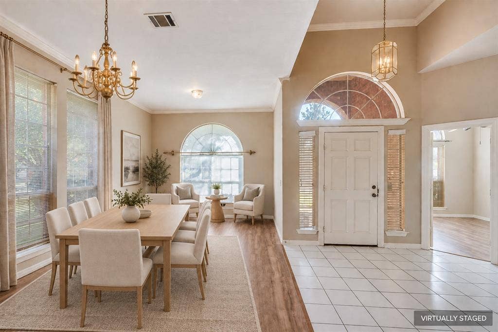 2305 Pittner Lane, Plano, TX 75025 Formal entry with high ceilings, an arched transom window, and tiled flooring