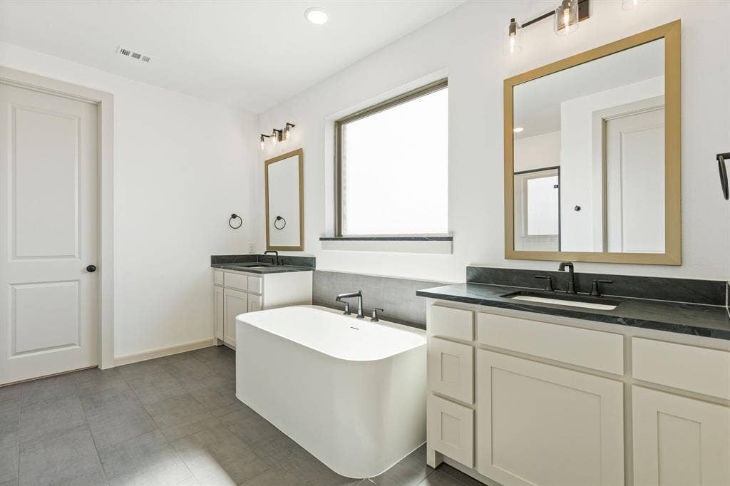2612 Radiant Way, Celina, TX 75009 You'll enjoy ample room for two in this wonderfully designed owner's bath.